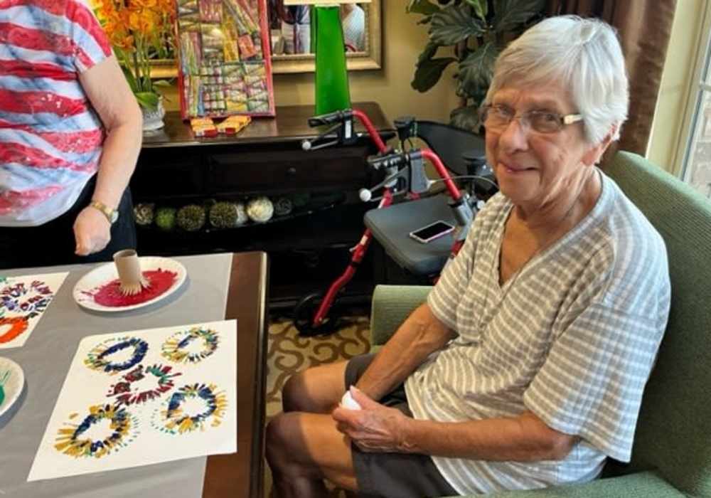 Resident doing arts and crafts at Truewood by Merrill, Keller in Keller, Texas