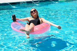 A resident and her small puppy at The Waters at Millerville in Baton Rouge, Louisiana