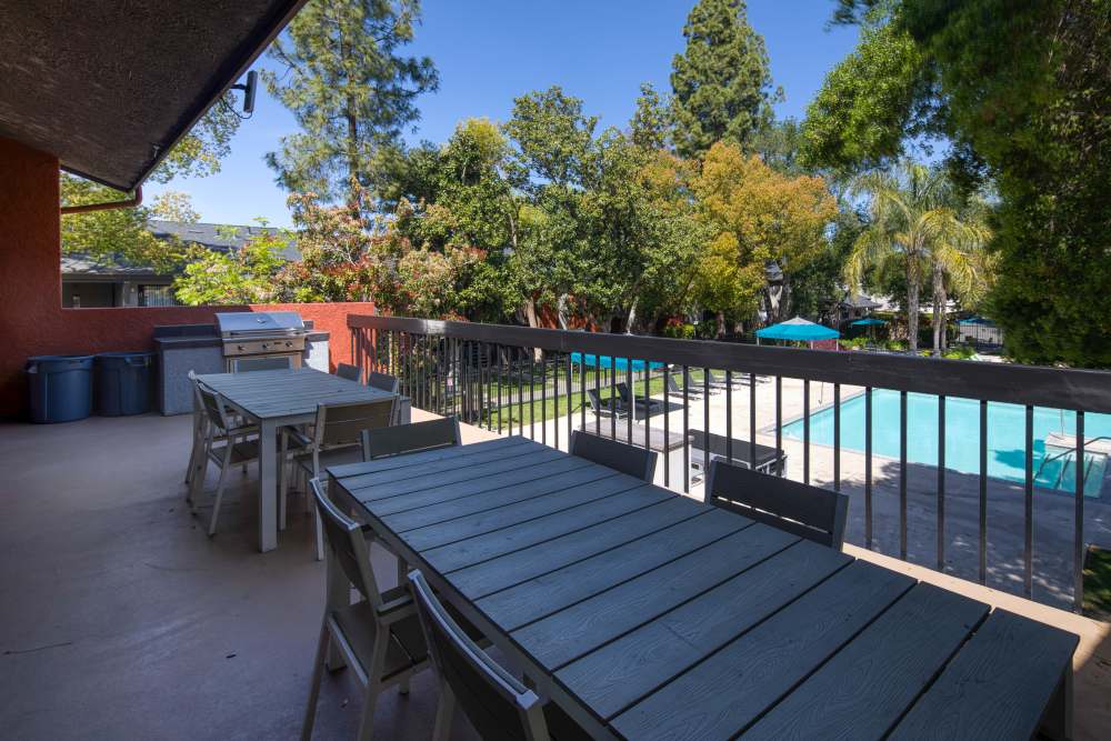 Outdoor barbeque area with seating at Falls at Arden in Sacramento, California