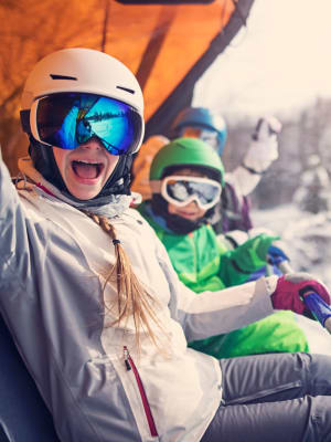 People on a ski chair lift near The Towne at Northgate Apartments in Colorado Springs, Colorado