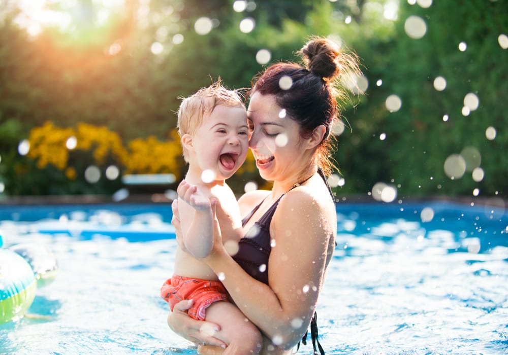 Residents playing in the pool at Sundance Apartments in College Station, Texas