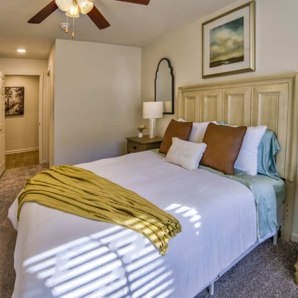 Well-furnished bedroom at Avonlea Towne Lake in Woodstock, Georgia