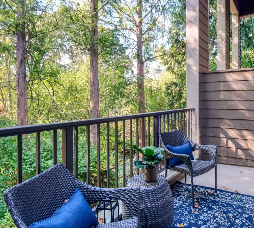 Back patio with a beautiful view of the forest at Waterhouse Place in Beaverton, Oregon