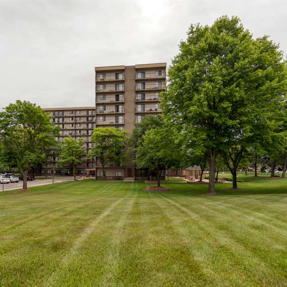 An apartment surrounded by greenery at Burton Place in Burton, Michigan