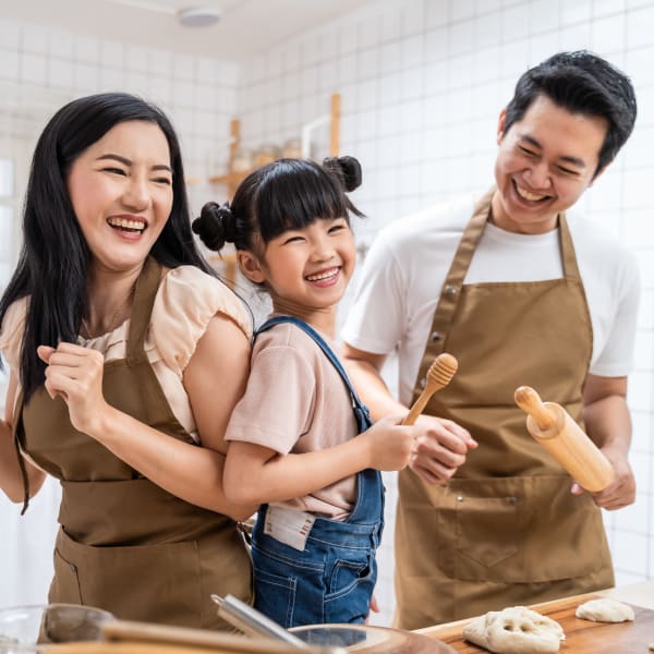 Family cooking together at Olympus Chandler at the Park in Chandler, Arizona