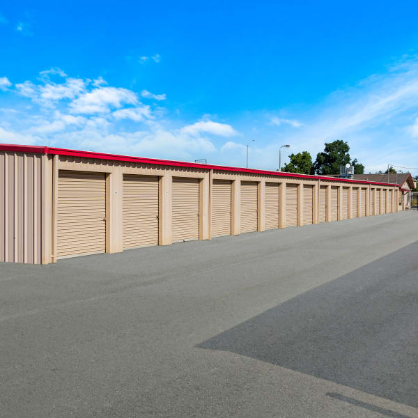 Outdoor storage units with wide drive aisles at StorQuest Self Storage in Ripon, California