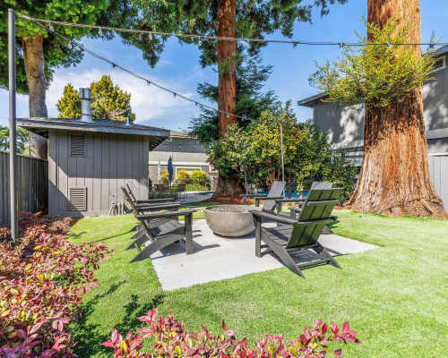 Courtyard with lawn and firepit at Pruneyard West Apartment Homes, Campbell, California