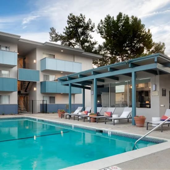 Woman on her phone while sitting outdoors at ArtHaus Central in Alameda, California 