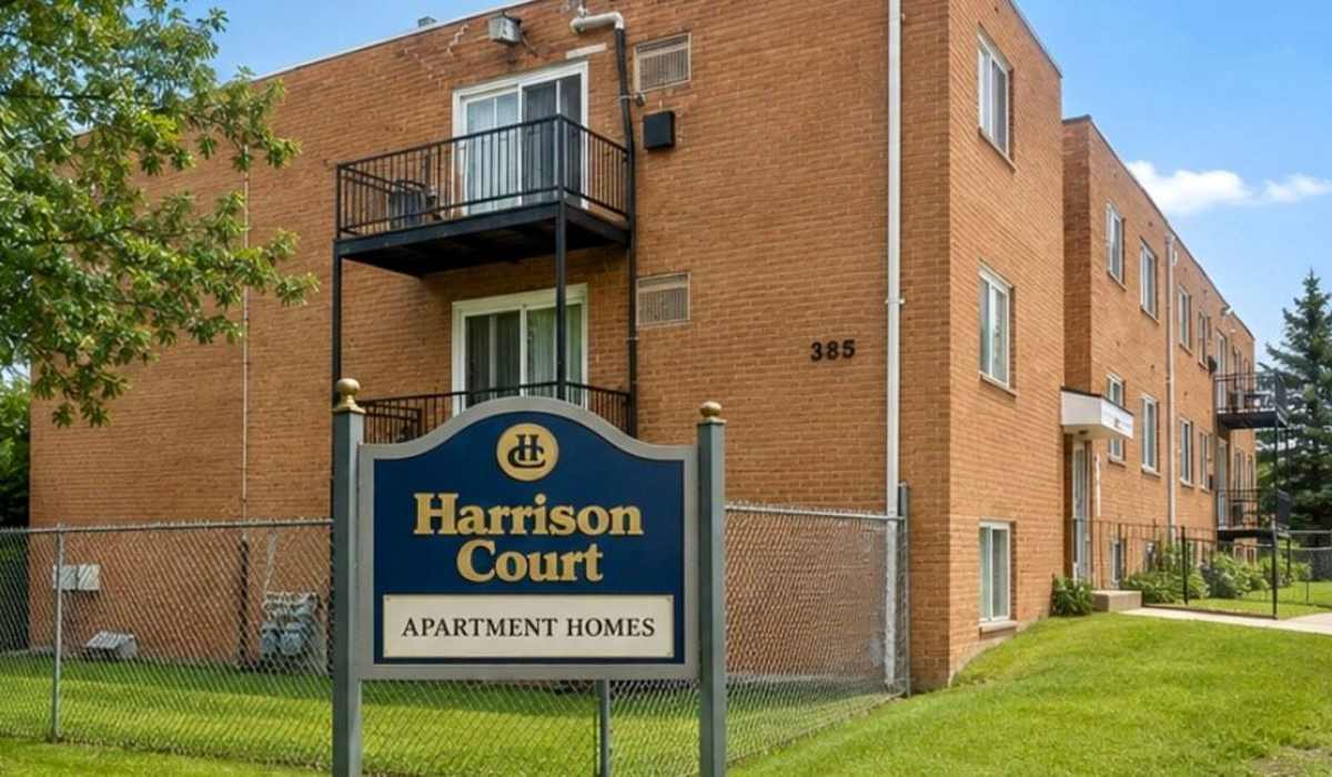 Exterior building with community sign and grass at Stonehurst Manor and Harrison Court in Upper Darby Township, Pennsylvania