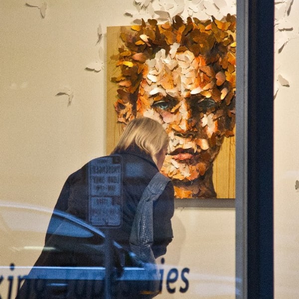 Resident enjoying art work near The Wave at Stadium Place in Seattle, Washington