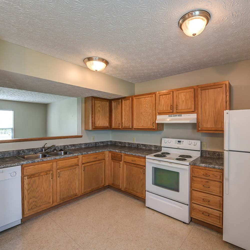 Kitchen with sleek white appliances at Webster Greene in Peebles, Ohio