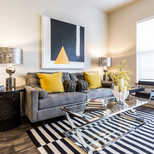 Bright and modern style living room with colorful décor at Marq Uptown in Austin, Texas