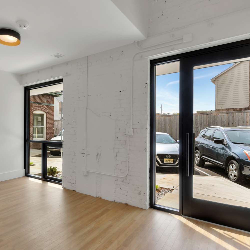 Unfurnished area with wood flooring and sliding glass doors at 189 Barksdale in Memphis. TN