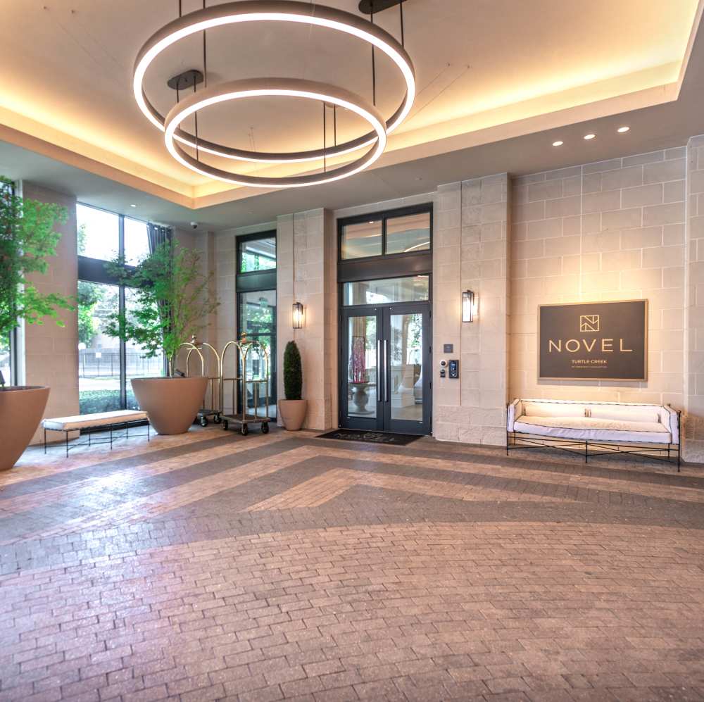 Modern lobby with large windows and stylish lighting at Novel Turtle Creek in Dallas, Texas