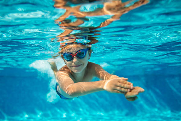 Child in swimming poo at The Mews At Dixon Farms in Dixon, California