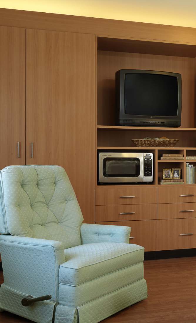 blue recliner chair in a senior bedroom at Dougherty Ferry in Valley Park, Missouri