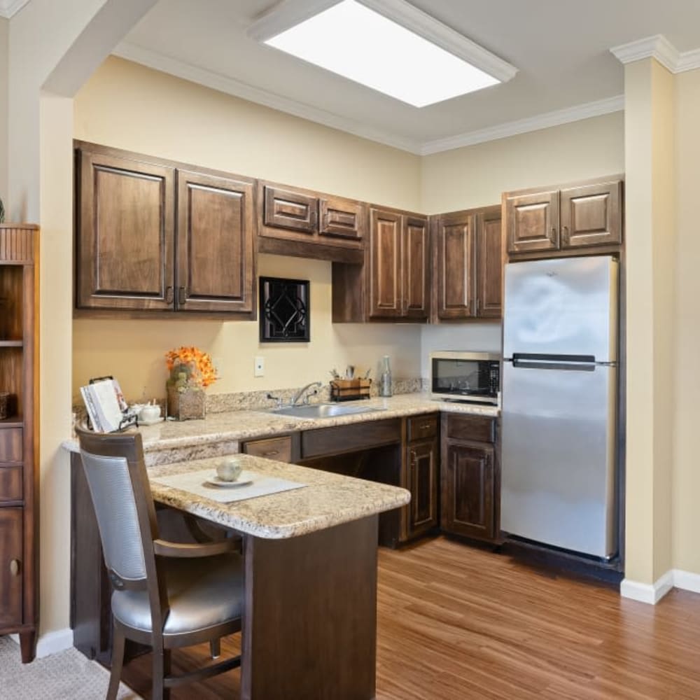 Kitchen with hardwood floors in apartment at Anthology of Stonebridge Ranch in McKinney, Texas