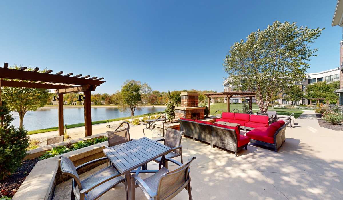Lake view with seating area nearby Latitude at Deerfield Crossing in Mason, Ohio 