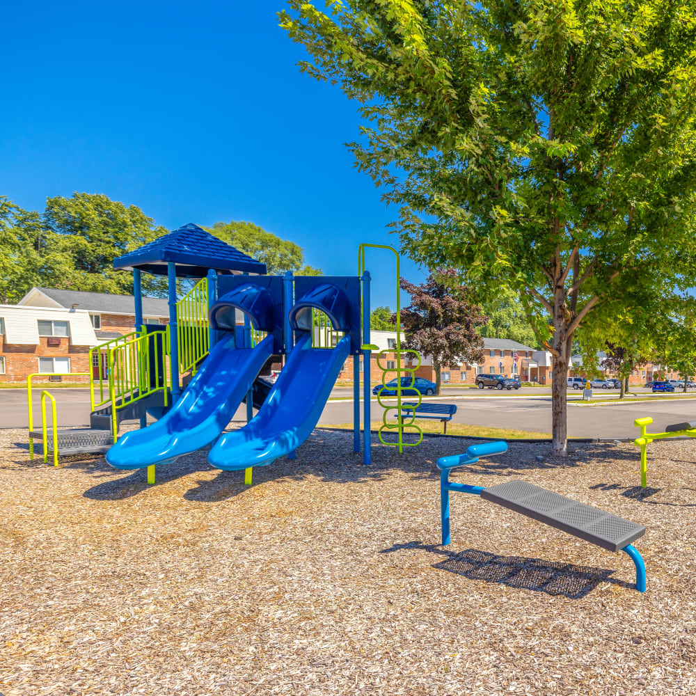 Playground next to outdoor fitness stations at Parkway Manor Apartments in Irondequoit, New York