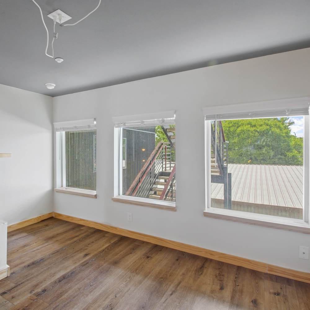 Loft with large windows at The Lofts at 305 in Bryan, Texas