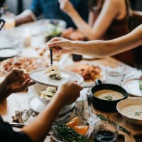 Resident friends out for a feast at their favorite restaurant near Bridgeview Apartments in San Diego, California