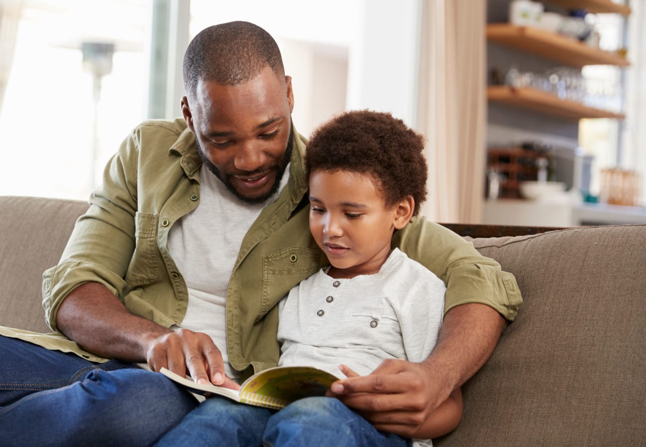 Father reading with his son at The Trails at Canyon Crest in Riverside, California