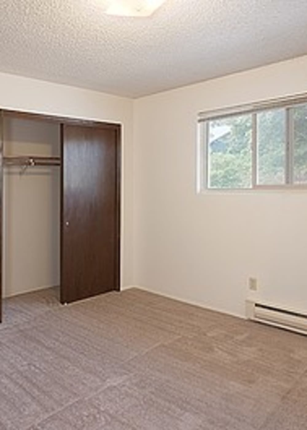 Closet in a bedroom at Park Hill Apartments in Seattle, Washington