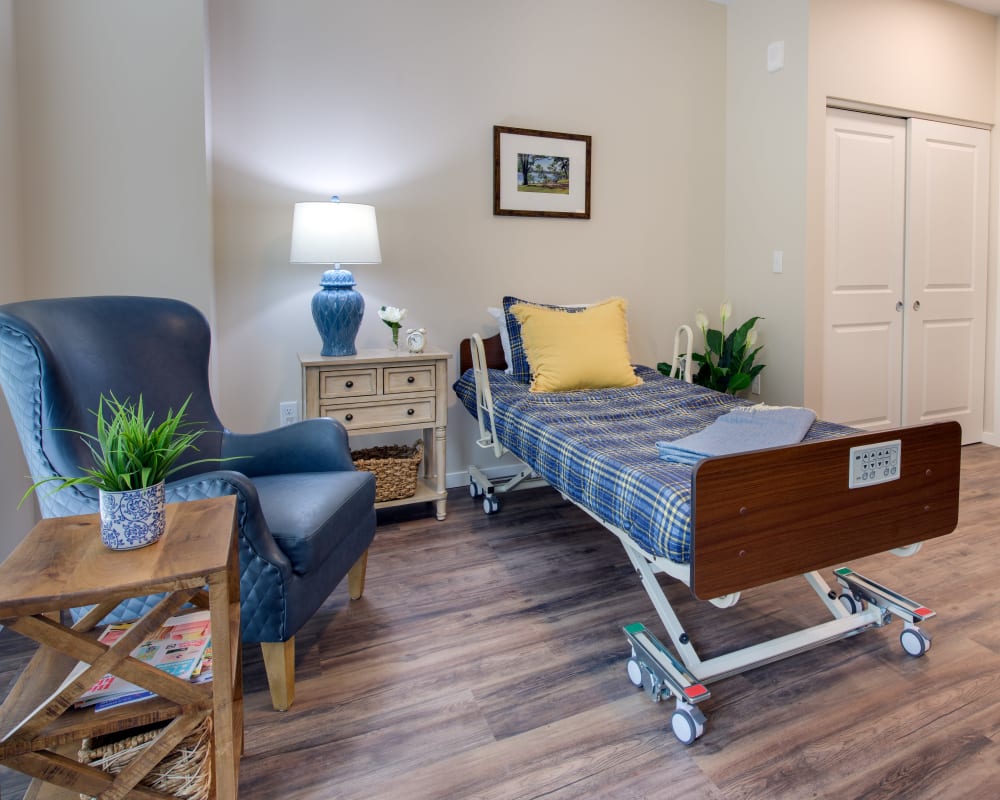 A living space with a single bed at The Pillars of Prospect Park in Minneapolis, Minnesota