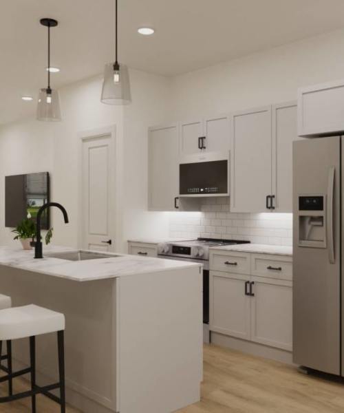 A modern kitchen with sleek cabinetry, stainless steel appliances, and a stylish island countertop at One West End in Charlotte, North Carolina
