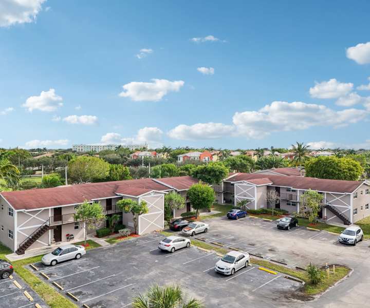 Exterior shot of apartment with off street parking at El Jardin Apartments in Hollywood, Florida 
