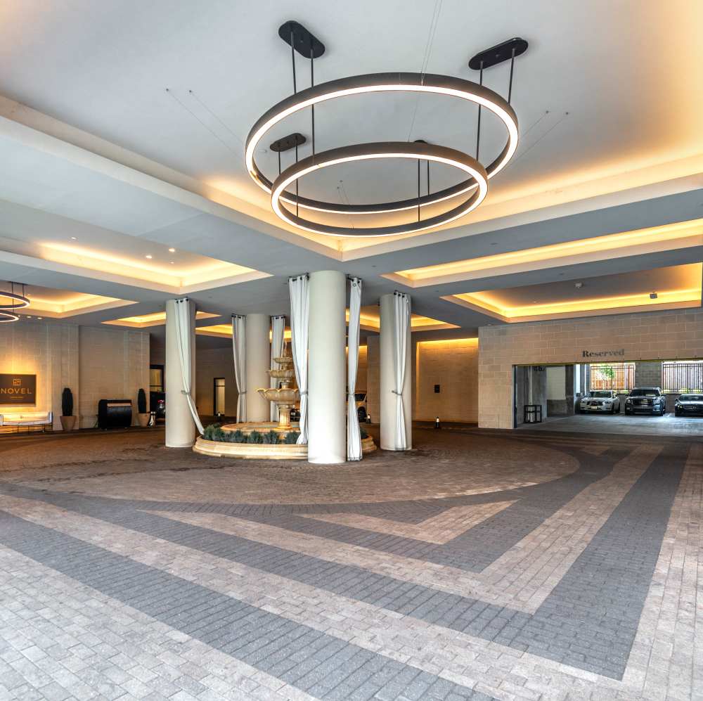 Modern lobby with circular lighting at Novel Turtle Creek in Dallas, Texas