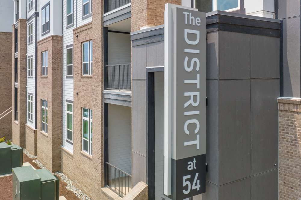 Exterior shot with property signage at District at 54 in Raleigh,North Carolina