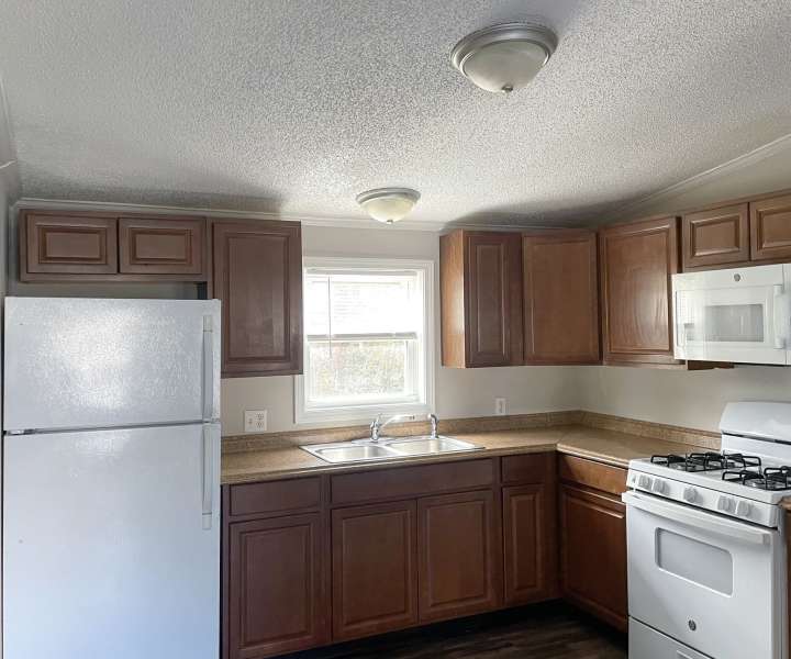 Interior of a modern apartment home kitchen at Fairview Crossing in Scottsburg, Indiana