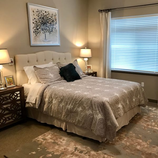 Bedroom inside an apartment at a Living Care Lifestyles community