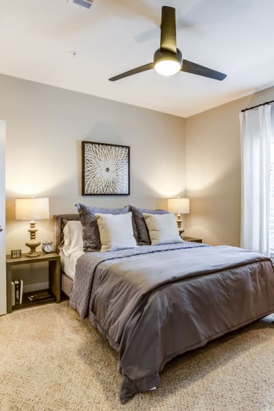 Cozy bedroom with a nice ceiling fan to keep you cool at Rivertop Apartments in Nashville, Tennessee