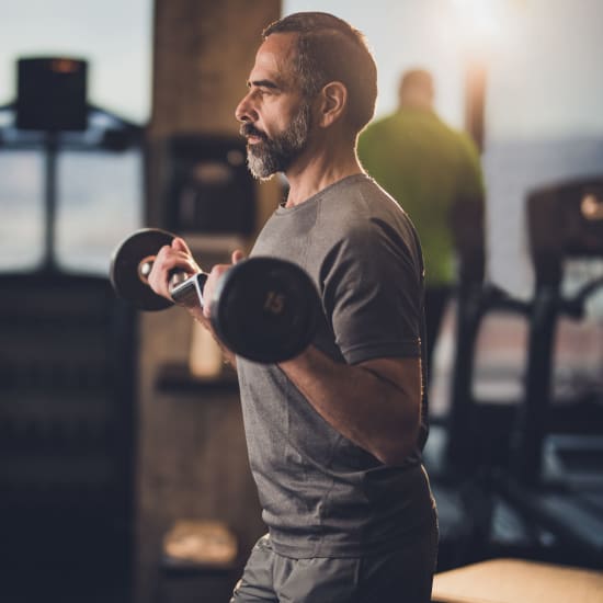 Resident working out in the gym at ila Hyde Park in Cincinnati, Ohio