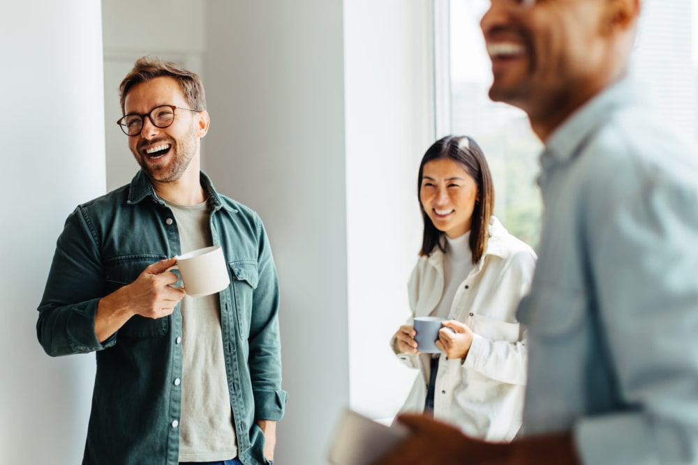 Coworkers talking at Ari Apartment Management