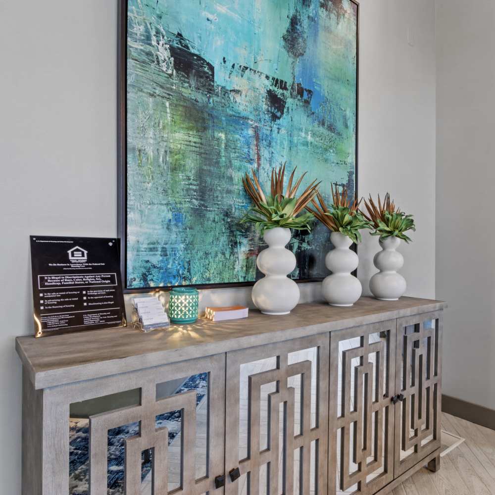 Community gathering room with beautiful painting at The Ashton in Raleigh, North Carolina