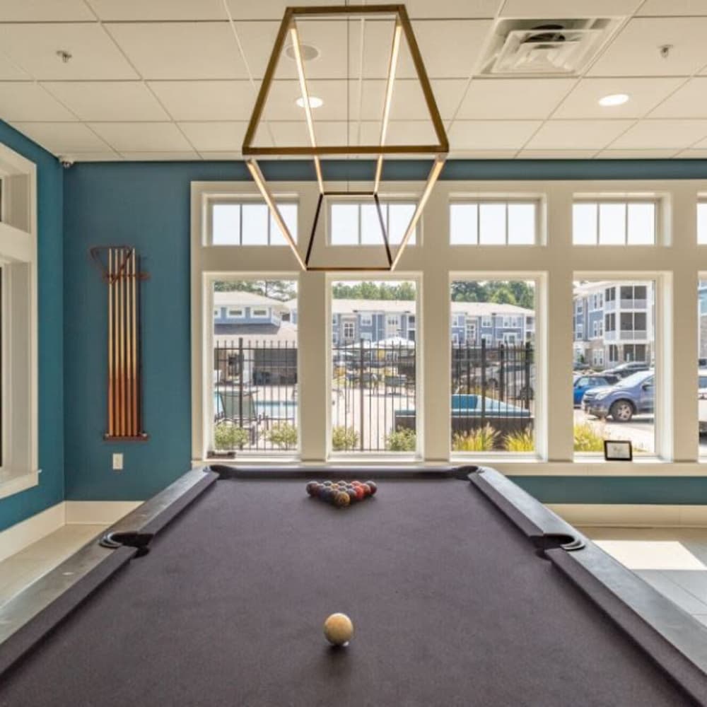 A pool-table in the clubhouse at The Apartments At Kelton Station in Williamsburg, Virginia
