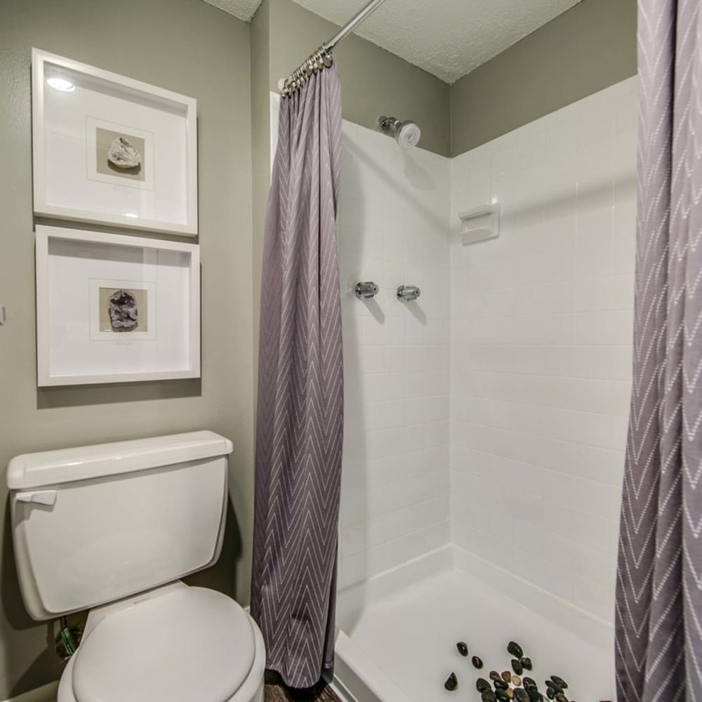Bathroom with shower at London House Apartments in Lenexa, Kansas