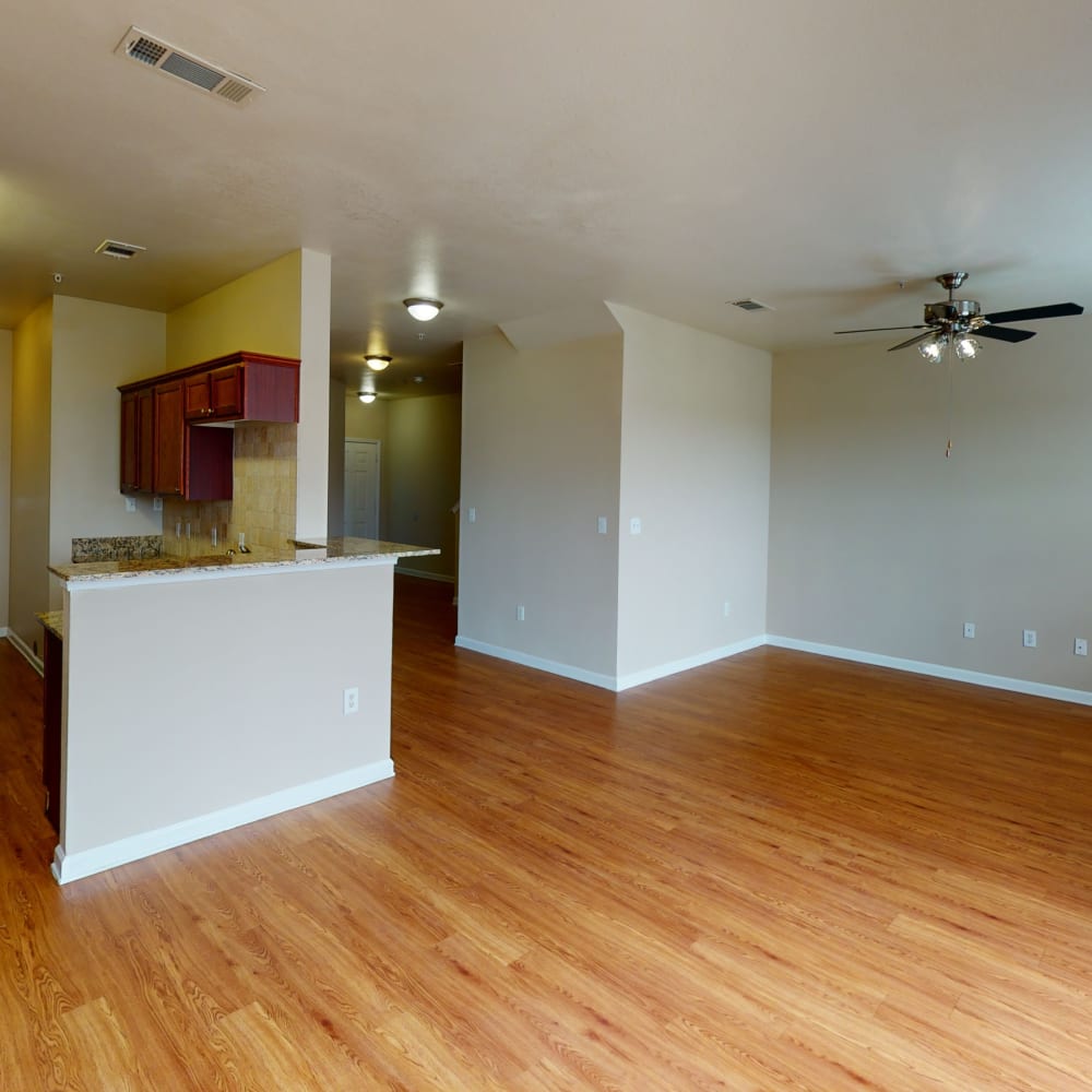 Beautiful hardwood flooring in the living areas of a townhome at Oaks Estates of Coppell in Coppell, Texas