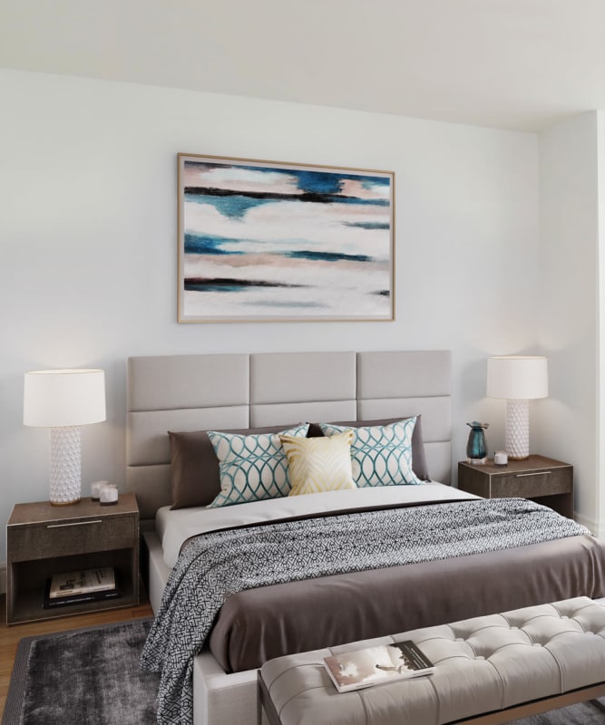 A modern bedroom with wood-style flooring at The Metropolis in New York, New York