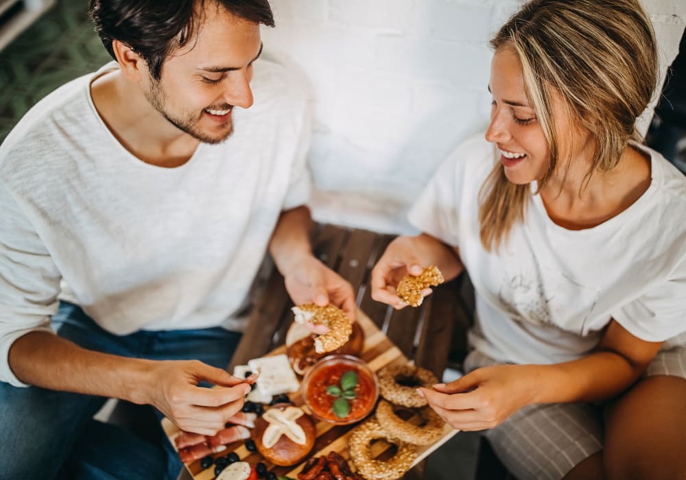 Residents eating pizza near Legacy Brooks in San Antonio, Texas
