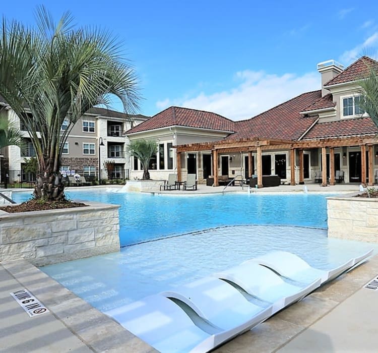 Beautiful swimming pool on a hot summer's day at Trails at Lake Houston in Houston, Texas