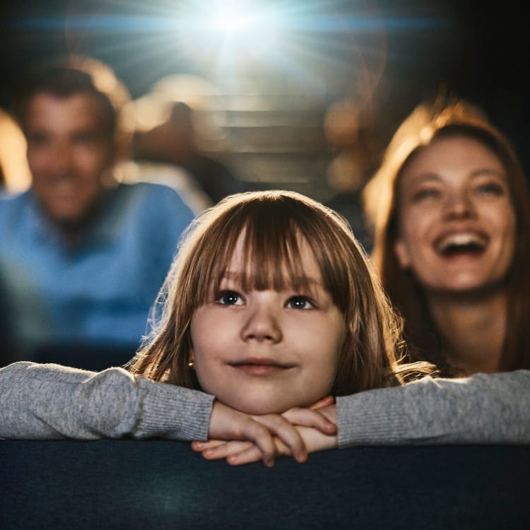 Family enjoying a movie in the cinema near 23Hundred at Ridgeview in Plano, Texas