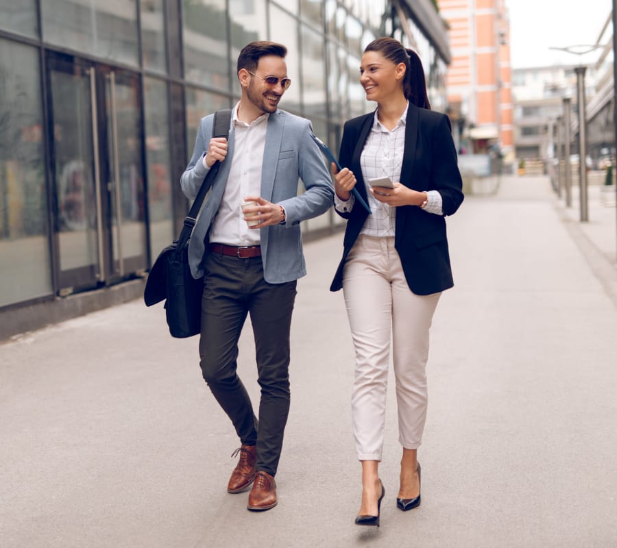 Resident discussing a project with a colleague outside their office near Haven Warner Center in Canoga Park, California
