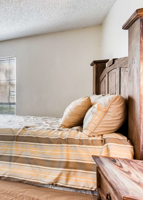 Bedroom with plush carpeting at Creekside in San Angelo, Texas