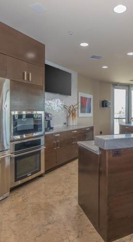 Apartment kitchen with wood-style flooring at The View at Wash Park in Denver,Colorado