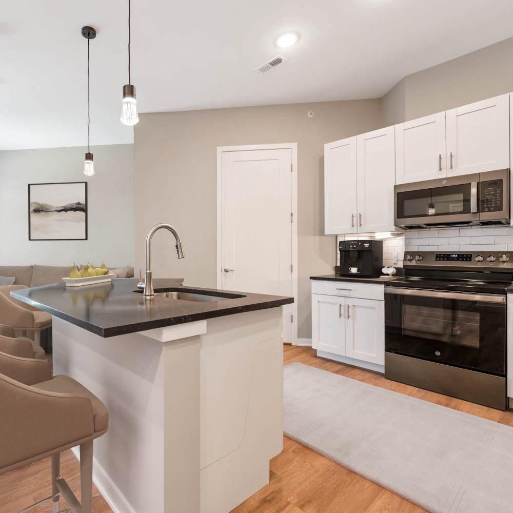 Kitchen with island countertop at Neo Vantage Point in Maryland Heights, Missouri