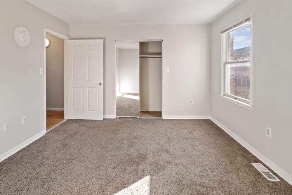 Unfurnished bedroom with closet and a window at Blue Ridge Apartments in Winchester, Virginia